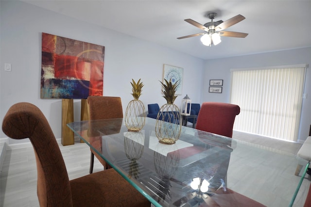 dining area featuring hardwood / wood-style floors and ceiling fan