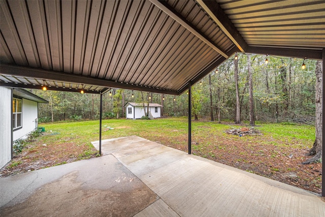 view of patio / terrace with a storage shed