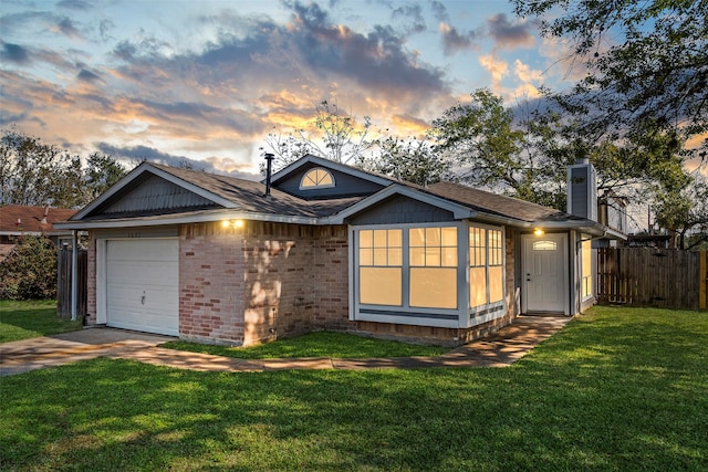 view of front facade featuring a yard and a garage