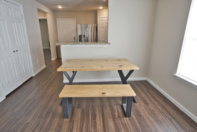 dining room with dark hardwood / wood-style flooring