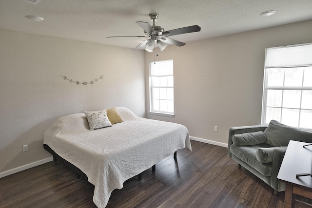 bedroom featuring ceiling fan and dark hardwood / wood-style flooring