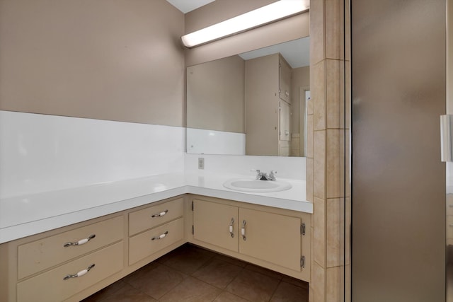 bathroom featuring tile patterned flooring and vanity