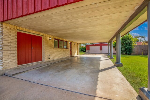 view of patio with a garage and an outdoor structure