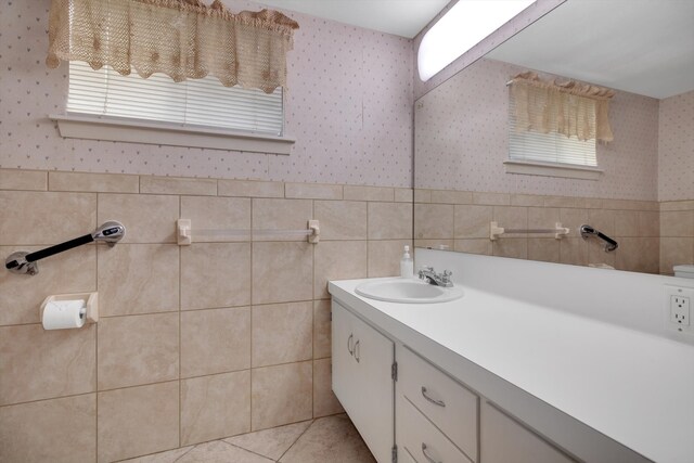 bathroom featuring tile patterned flooring and vanity