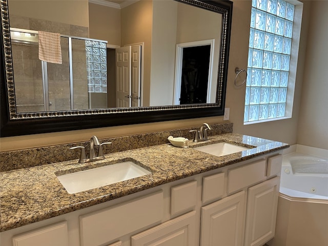 bathroom with ornamental molding, vanity, a wealth of natural light, and independent shower and bath