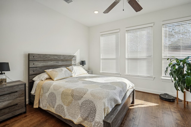 bedroom featuring ceiling fan and dark wood-type flooring