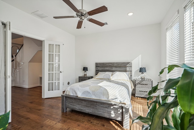 bedroom featuring ceiling fan, french doors, and dark wood-type flooring