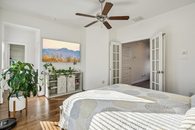 bedroom featuring ceiling fan, dark hardwood / wood-style flooring, and french doors