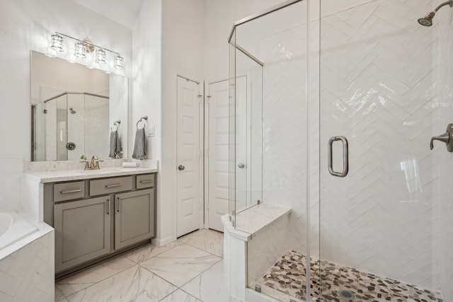 bathroom with separate shower and tub and vanity