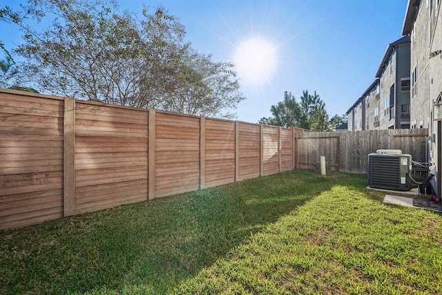 view of yard with central AC