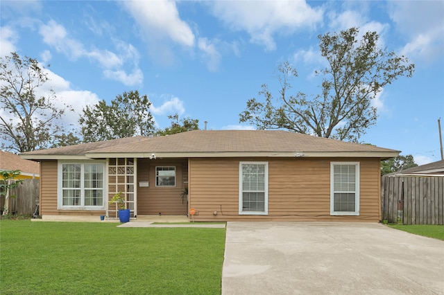 rear view of house featuring a yard and a patio