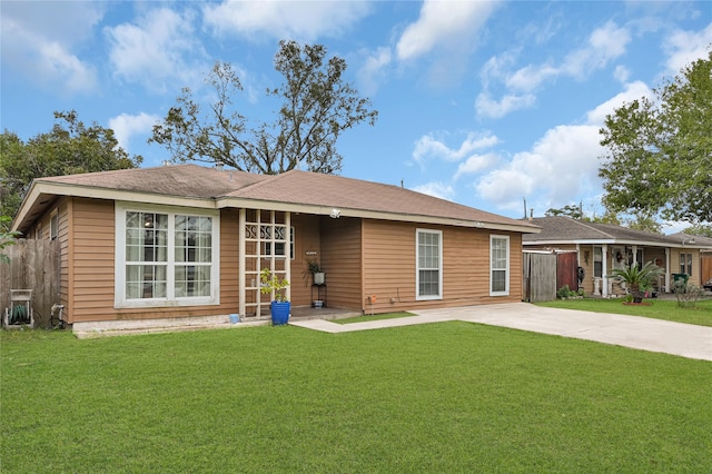 back of house with a yard