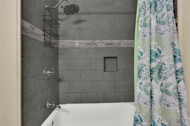 bathroom with shower / bath combination with curtain