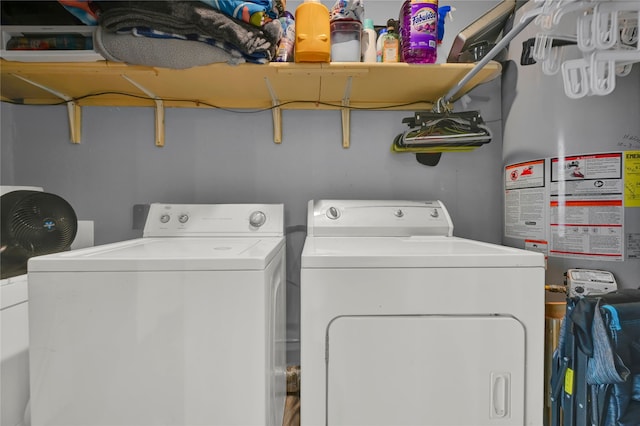 clothes washing area with washing machine and clothes dryer