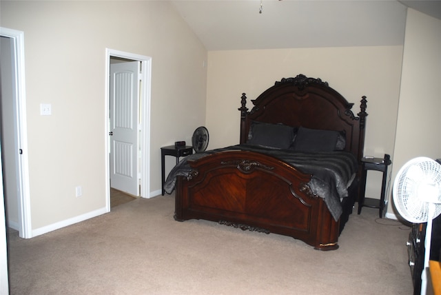 carpeted bedroom featuring lofted ceiling