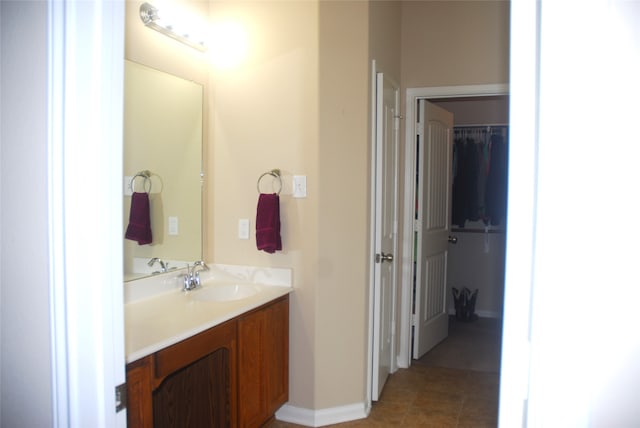 bathroom with tile patterned floors and vanity