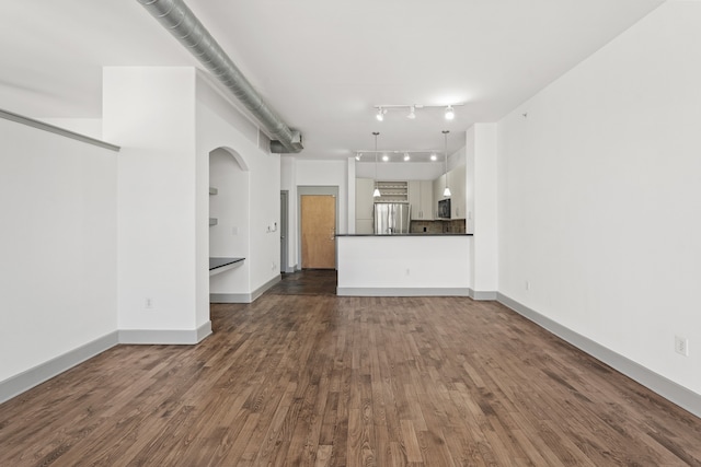 unfurnished living room featuring dark wood-type flooring