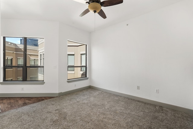 spare room with carpet and ceiling fan