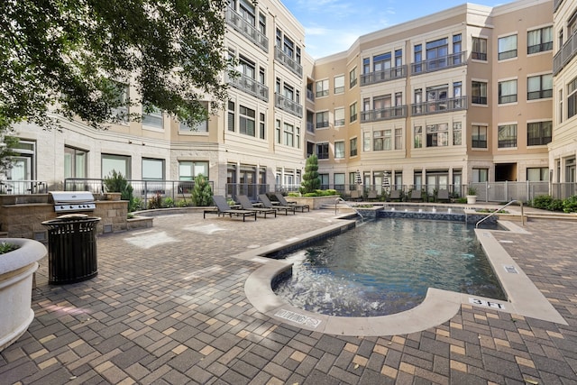 view of pool featuring area for grilling