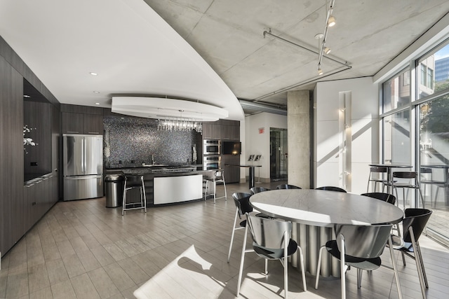 dining space featuring light wood-type flooring