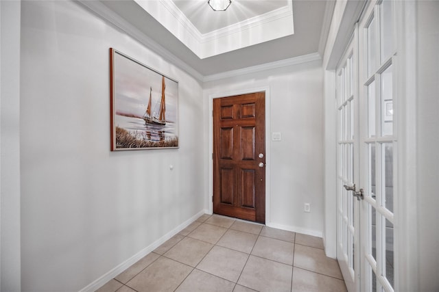 tiled entryway featuring ornamental molding and french doors