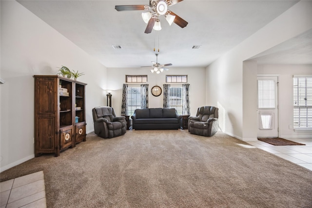 carpeted living room featuring ceiling fan