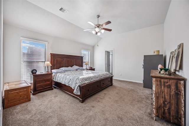 bedroom featuring ceiling fan, lofted ceiling, light colored carpet, and multiple windows