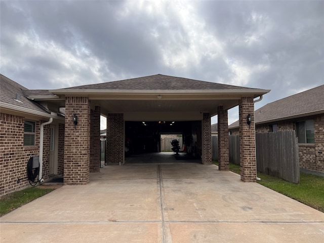 view of parking / parking lot featuring a carport