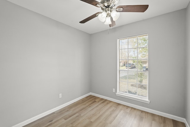 spare room featuring ceiling fan and light wood-type flooring