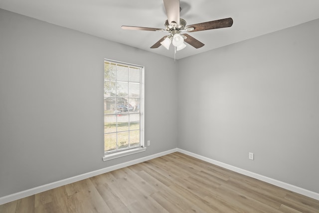 unfurnished room featuring ceiling fan, a healthy amount of sunlight, and light hardwood / wood-style flooring