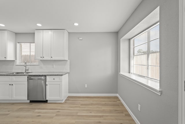 kitchen featuring light hardwood / wood-style flooring, white cabinetry, and a wealth of natural light