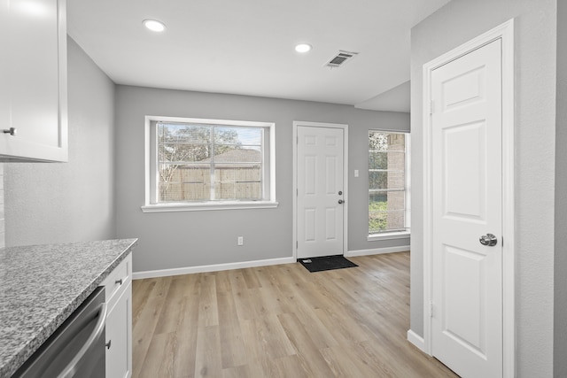 interior space featuring light hardwood / wood-style flooring and a healthy amount of sunlight