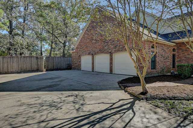 view of side of property with a garage