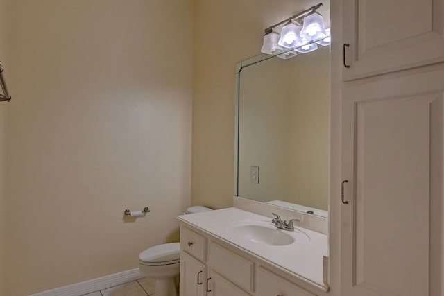 bathroom with tile patterned floors, vanity, and toilet