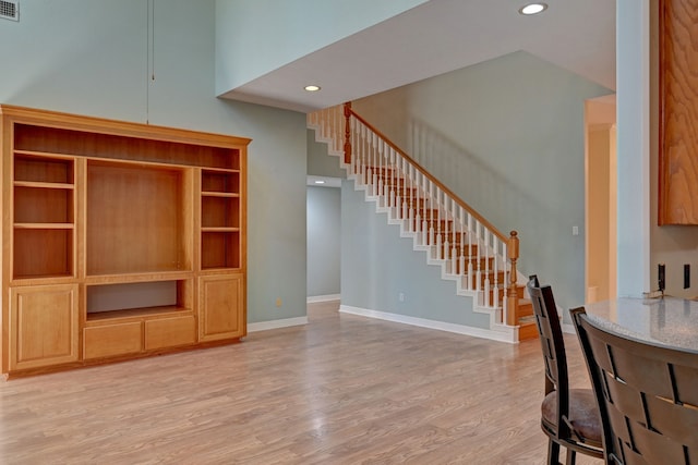 unfurnished living room with light hardwood / wood-style flooring