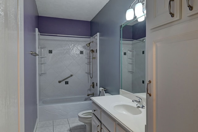 full bathroom featuring tile patterned flooring, vanity, tiled shower / bath combo, and toilet