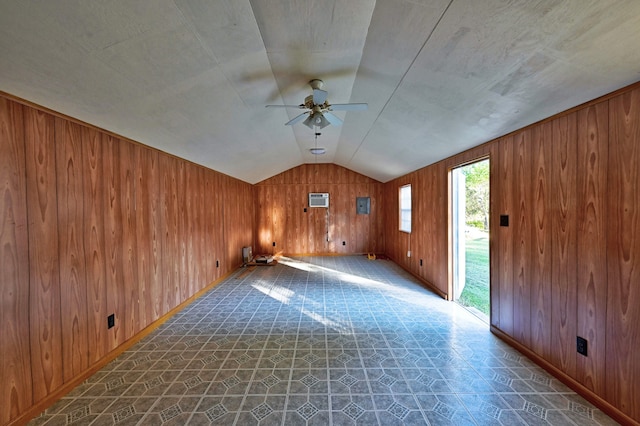 bonus room featuring a wall mounted AC, wooden walls, ceiling fan, and lofted ceiling