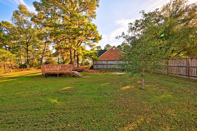 view of yard featuring a deck