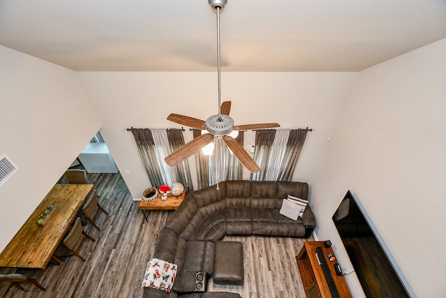 living room with hardwood / wood-style floors and ceiling fan