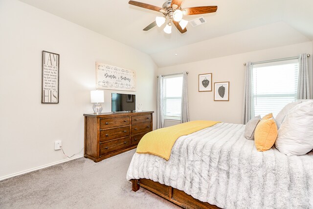 carpeted bedroom featuring ceiling fan and lofted ceiling