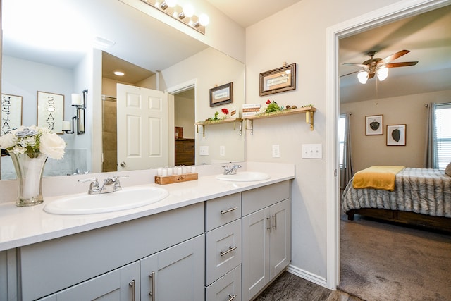 bathroom featuring ceiling fan and vanity