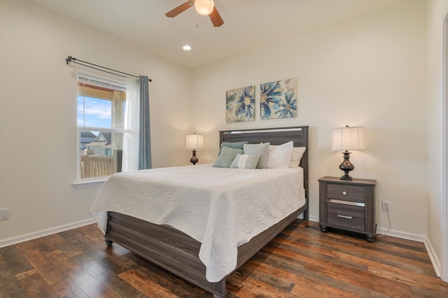 bedroom featuring ceiling fan and dark wood-type flooring