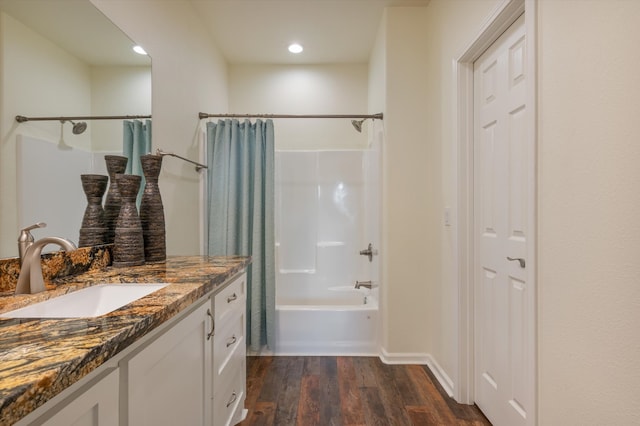 bathroom featuring shower / bath combo with shower curtain, vanity, and hardwood / wood-style flooring