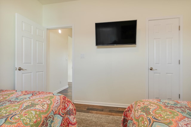 bedroom featuring dark hardwood / wood-style flooring