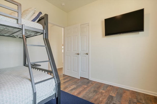 unfurnished bedroom featuring dark hardwood / wood-style floors