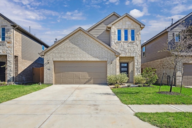 view of front of property with a garage and a front lawn