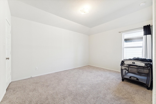 unfurnished room with light carpet