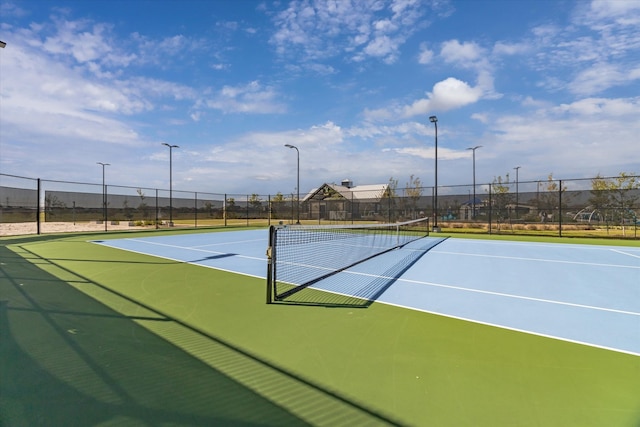 view of sport court featuring basketball hoop