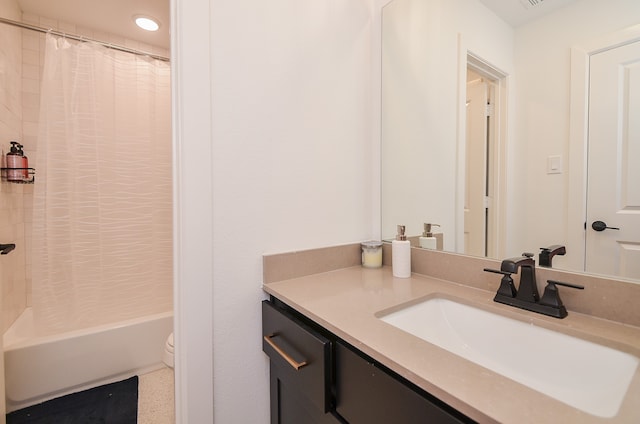 full bathroom featuring vanity, toilet, and shower / tub combo with curtain