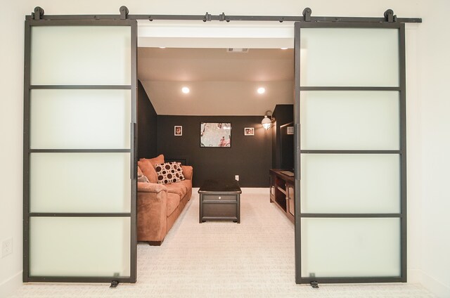 carpeted cinema with vaulted ceiling